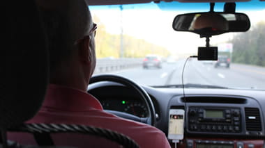 Man driving whilst using a sat nav